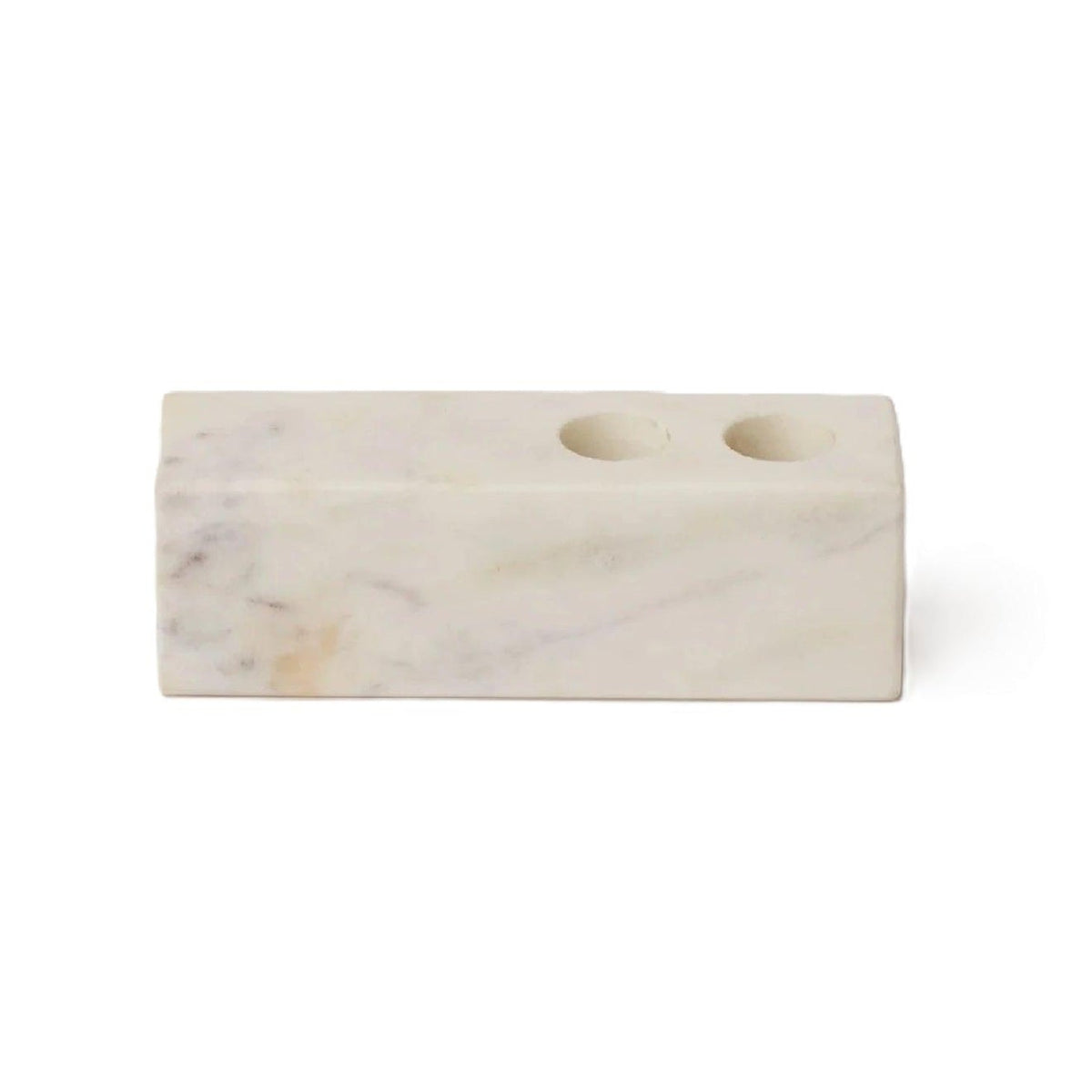 White marble candle holder block on white, showing the gray veining