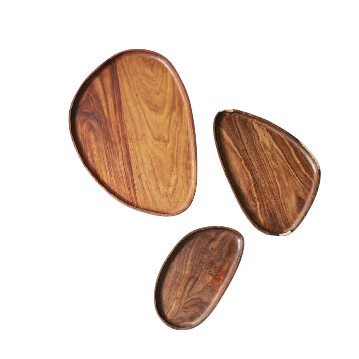 Three granadillo wood leaf trays in large, medium and small on a white background