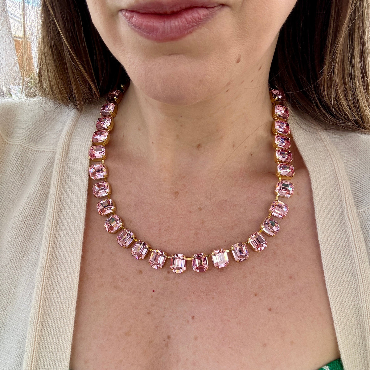 Model wearing the pink emerald-cut crystal necklace as a single strand.