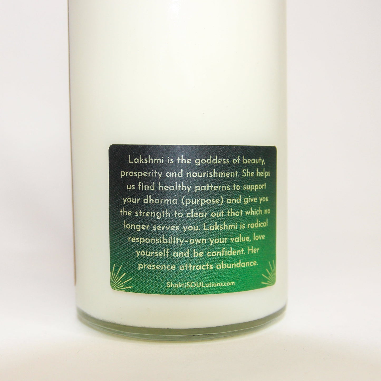 Lakshmi Crystal Altar Candle in a 16 oz glass tumbler with an image of the goddess Lakshmi on the label and golden crystals set into the wax — product photo 6
