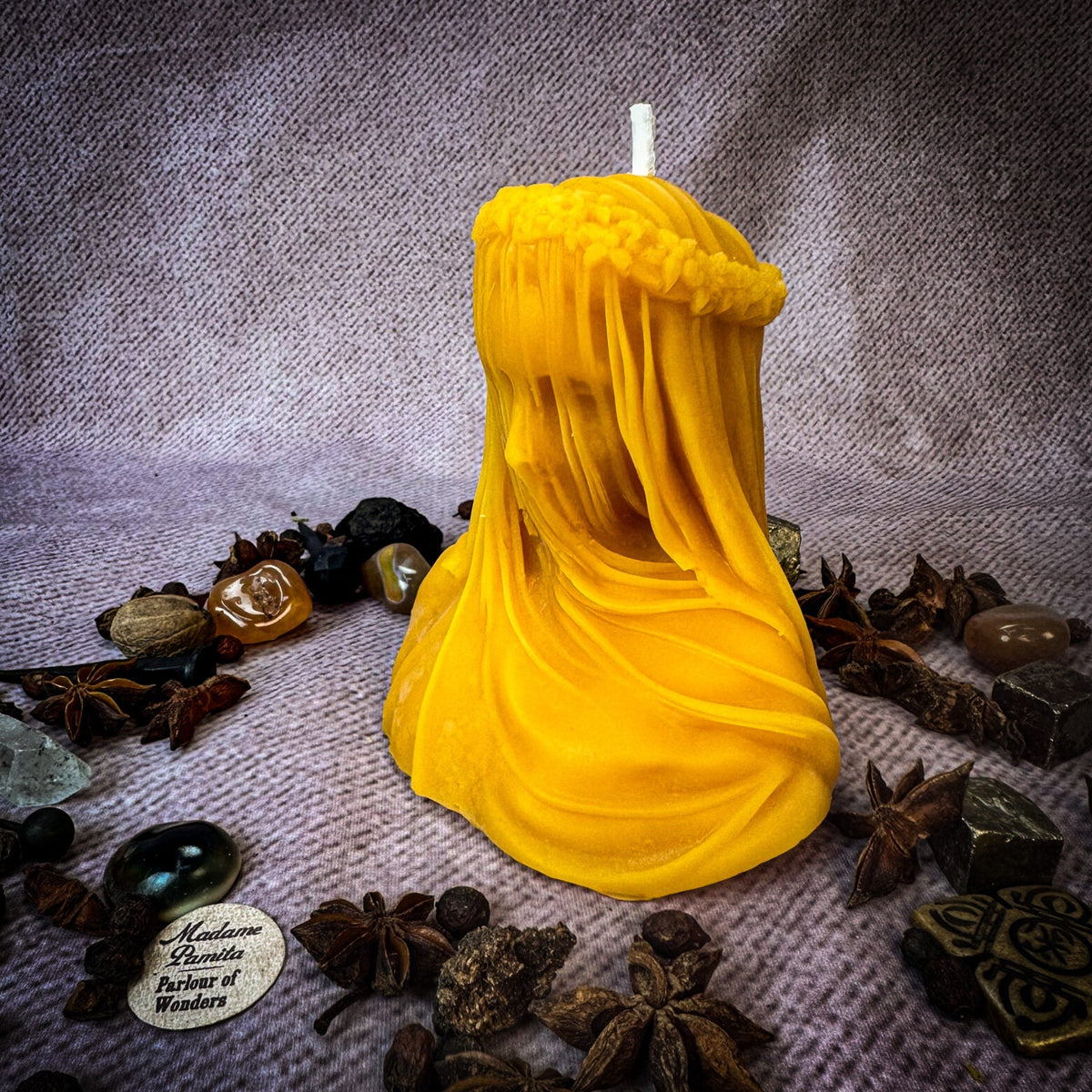 Veil of Secrets beeswax veiled figure candle in yellow with herbs and stones