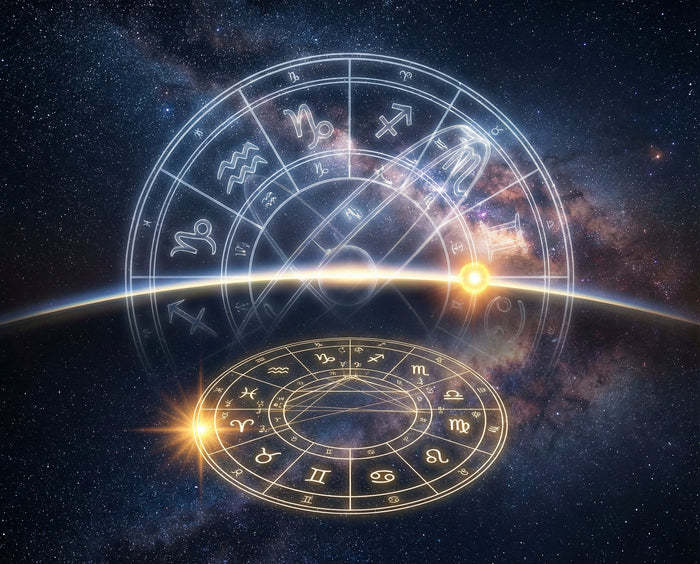 Glowing zodiac wheel with all twelve sign glyphs over a starfield, the rising point lit at the horizon line