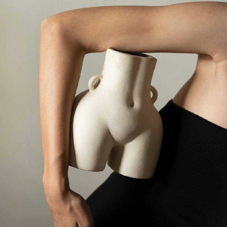 Off-white Her Vase held at the hip, showing scale against a person