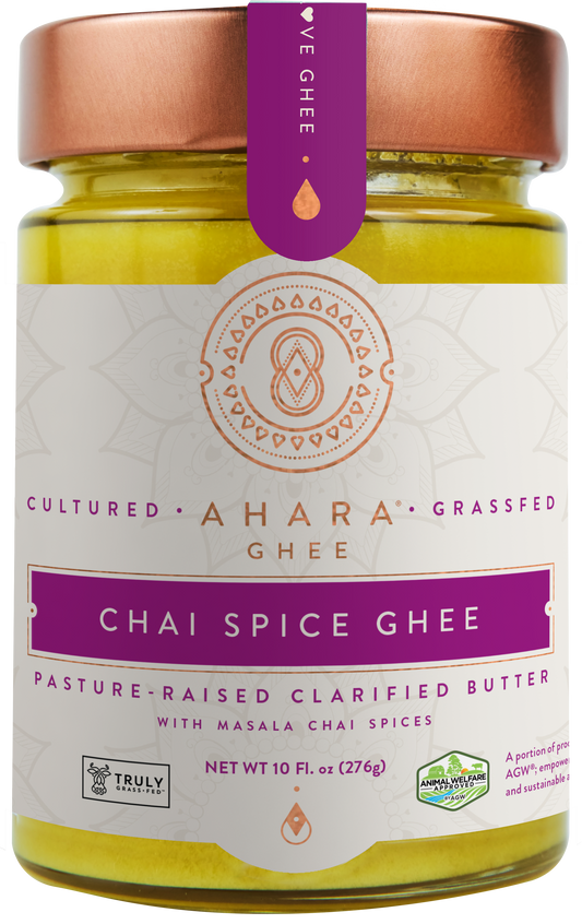 A glass jar of Ahara Rasa Chai Spice grass-fed ghee with a copper lid and purple label band.