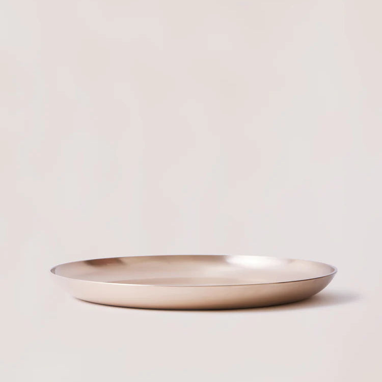 Kansa bronze platter from the side, showing the shallow rim