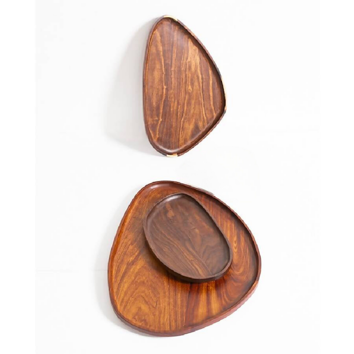 Small granadillo leaf tray resting inside a larger one, seen from above