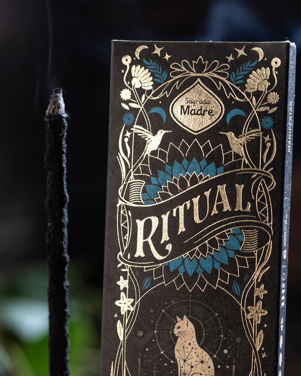 The Ritual box standing upright with its gold cat and moon illustration