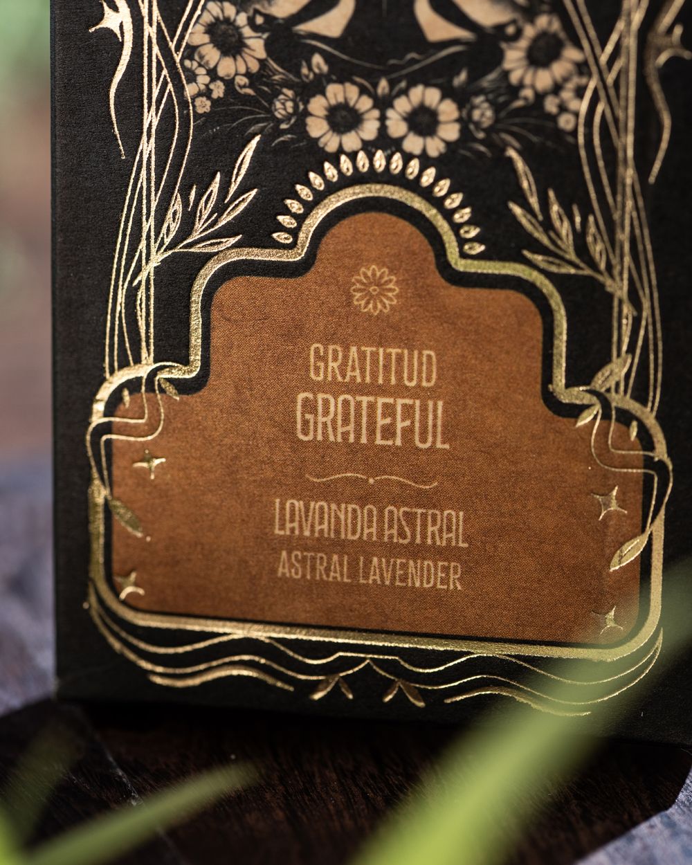Gratitud Grateful, Astral Lavender, printed in gold on the black Ritual box