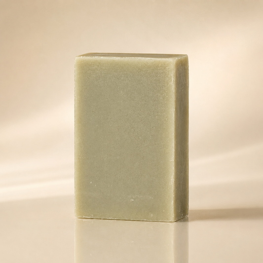 Bamboo and bentonite mud bar, deep charcoal-grey soap with a matte surface