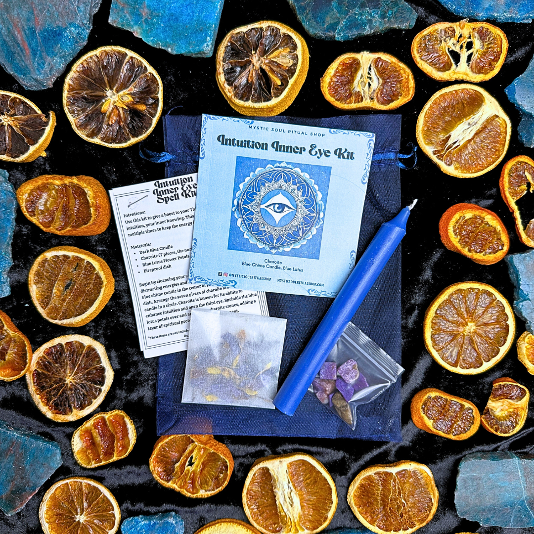The Inner Eye Intuition Spell Kit with a blue chime candle, charoite crystals and blue lotus.