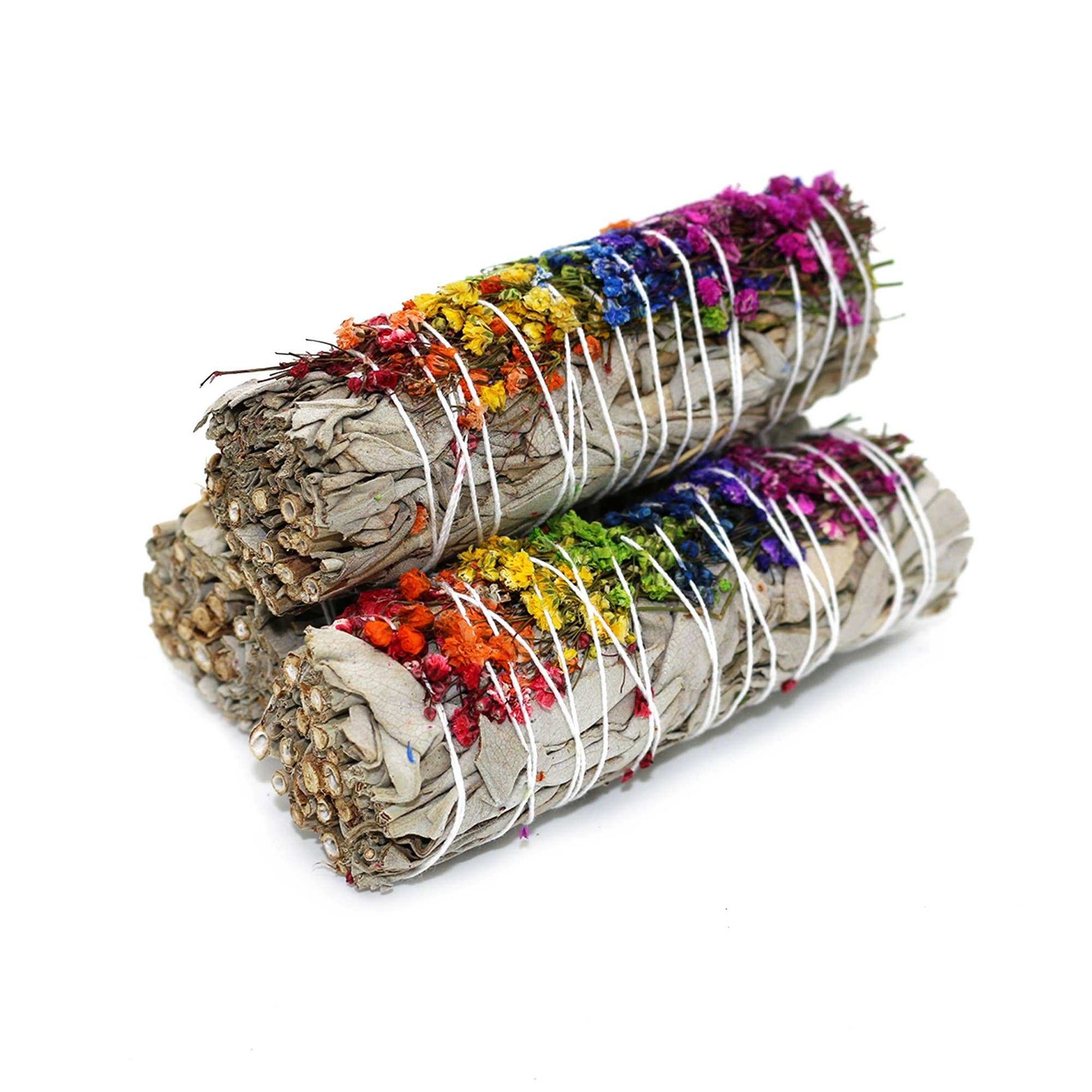 White sage smudge stick wrapped with an arrangement of dried flowers