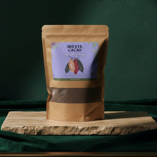 3rd Eye Cacao Theo Bro Man kraft pouch with a lavender label, on a wooden board against dark green velvet
