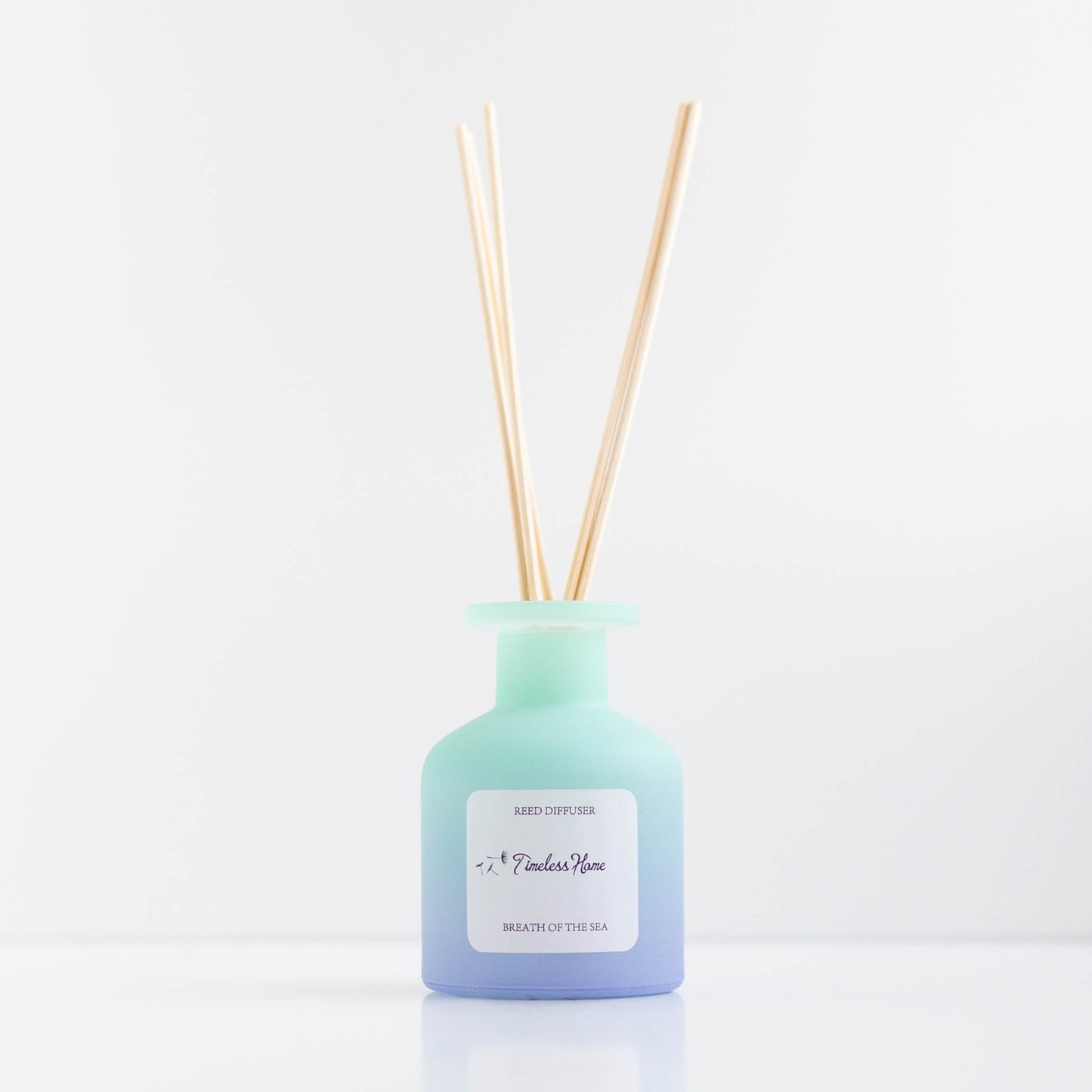Breathe of the Sea reed diffuser in a frosted glass vessel with five natural reed sticks