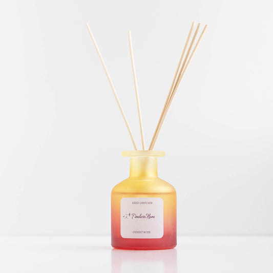 Desert Rose reed diffuser in a frosted glass vessel with five reeds