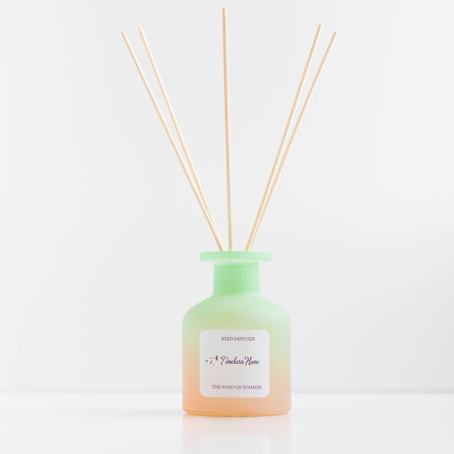 Wind of Summer reed diffuser in a frosted glass vessel with five reeds