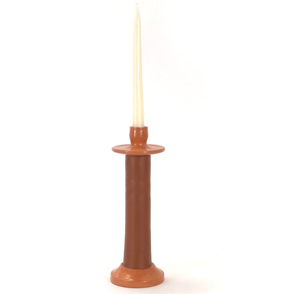 Terracotta leather-wrapped candle holder with a cream taper candle
