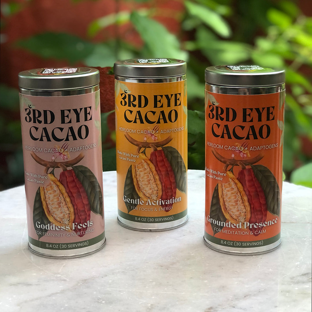 Three ceremonial cacao elixir canisters shown side by side.