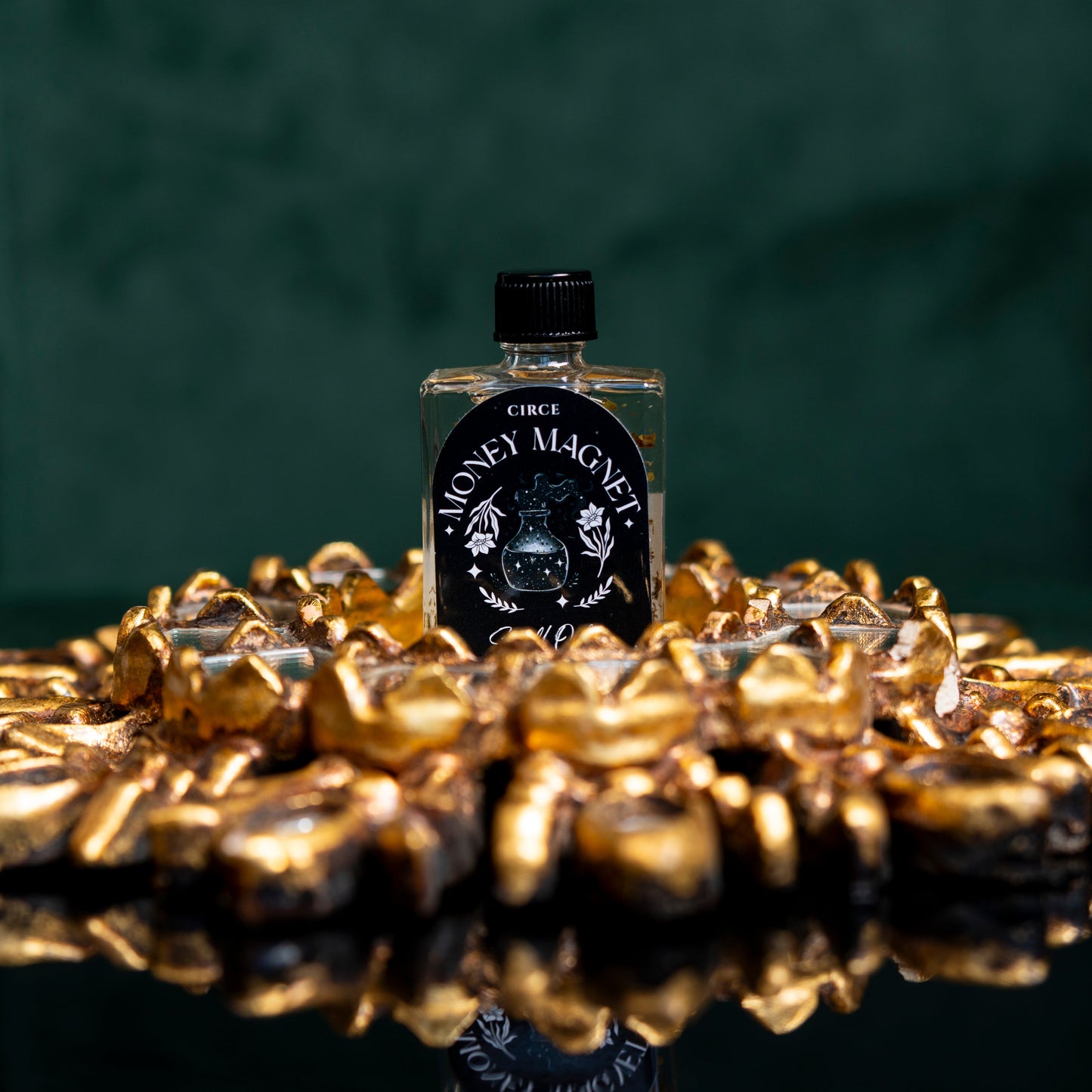 Money Magnet spell oil in a half ounce twist-top glass bottle (view 2)
