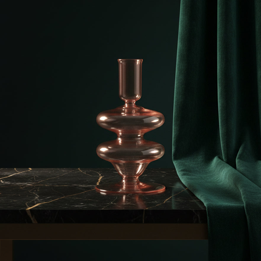 Pink glass Siri candle holder on dark marble against green velvet