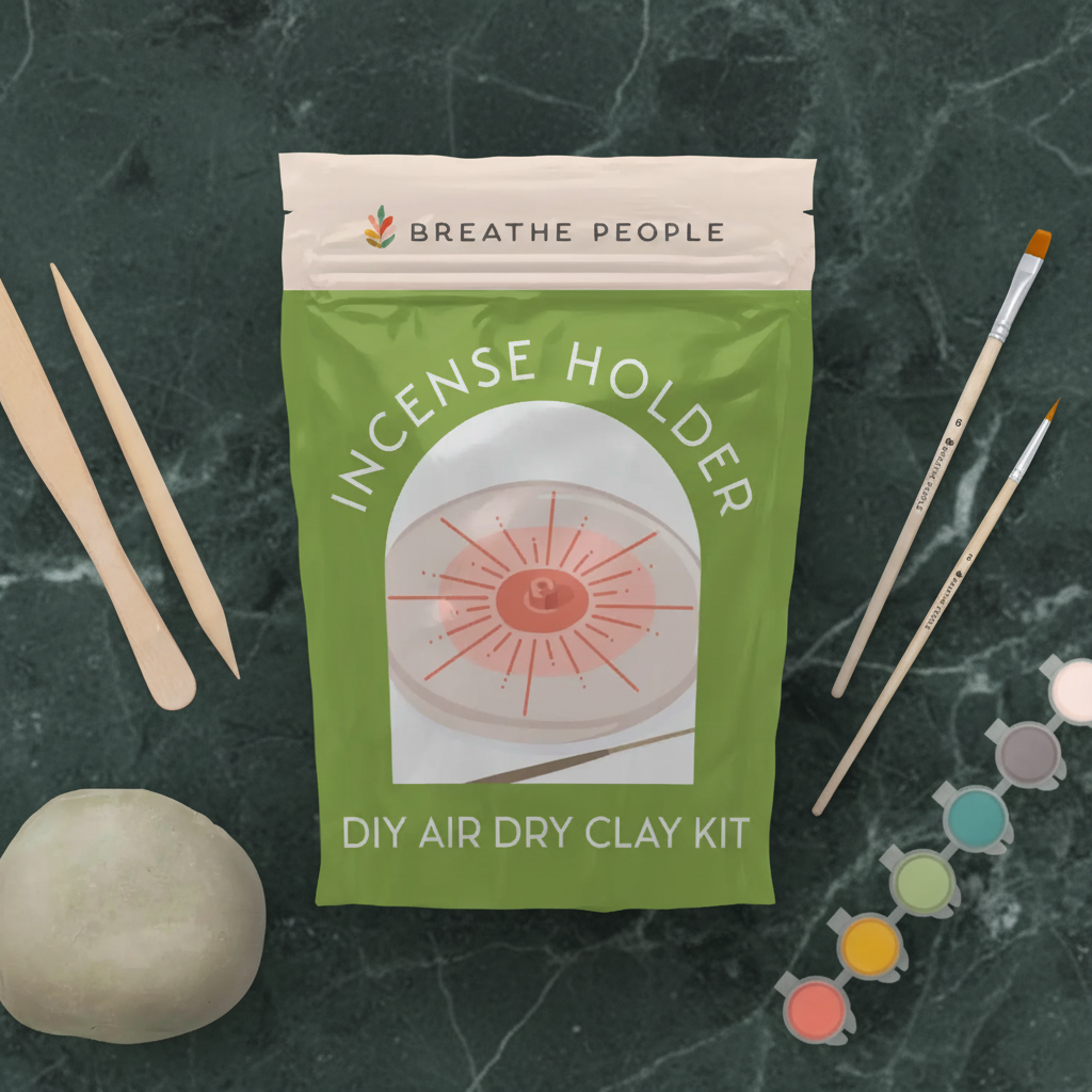 DIY air-dry clay incense holder kit in its green pouch with tools, brushes, paints and clay