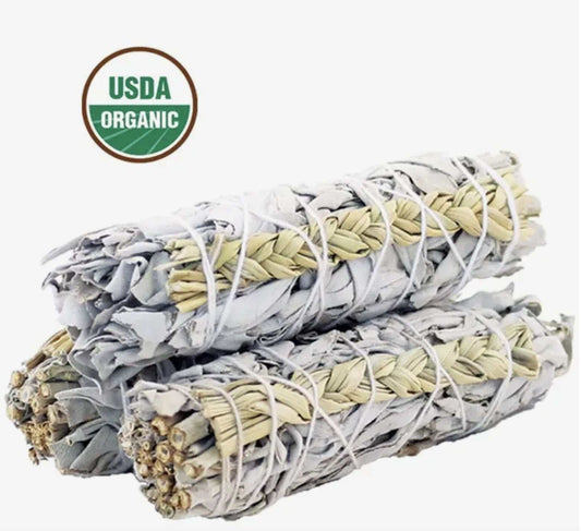 Four-inch smudge stick of organic white sage bound with strands of sweetgrass