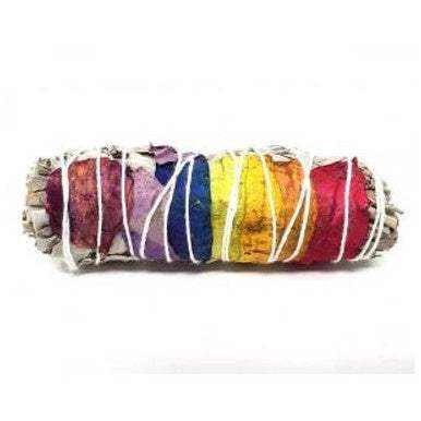 Seven-chakra rose petal and white sage smudge stick on a white background