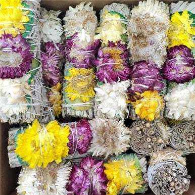 Four-inch white sage smudge stick wrapped with green rose petals and three dried flowers
