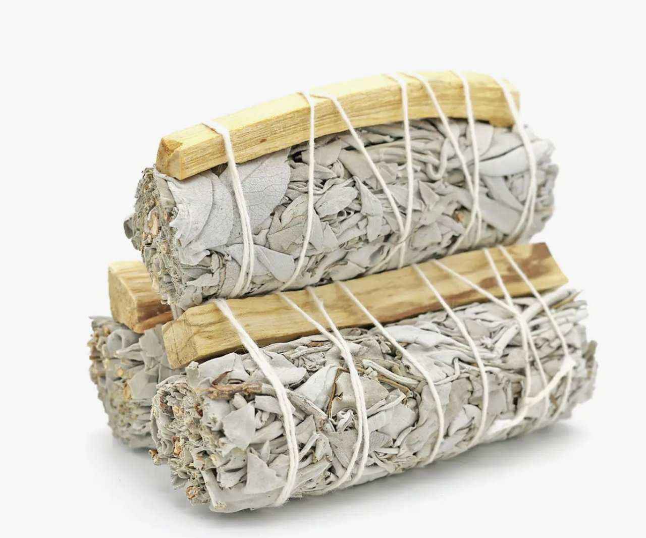 Four-inch white sage smudge stick bound together with palo santo wood