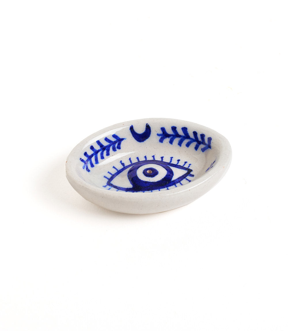 Jaipur blue pottery incense dish with a cobalt evil eye, brow and lash detail