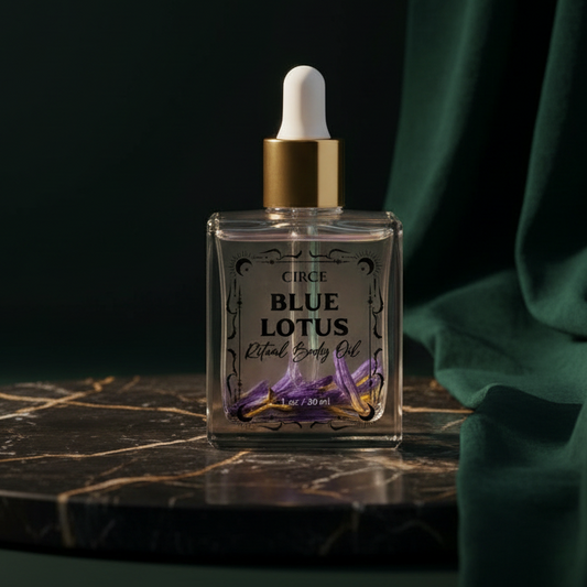 Circe Blue Lotus Ritual Body Oil standing on dark marble against green velvet