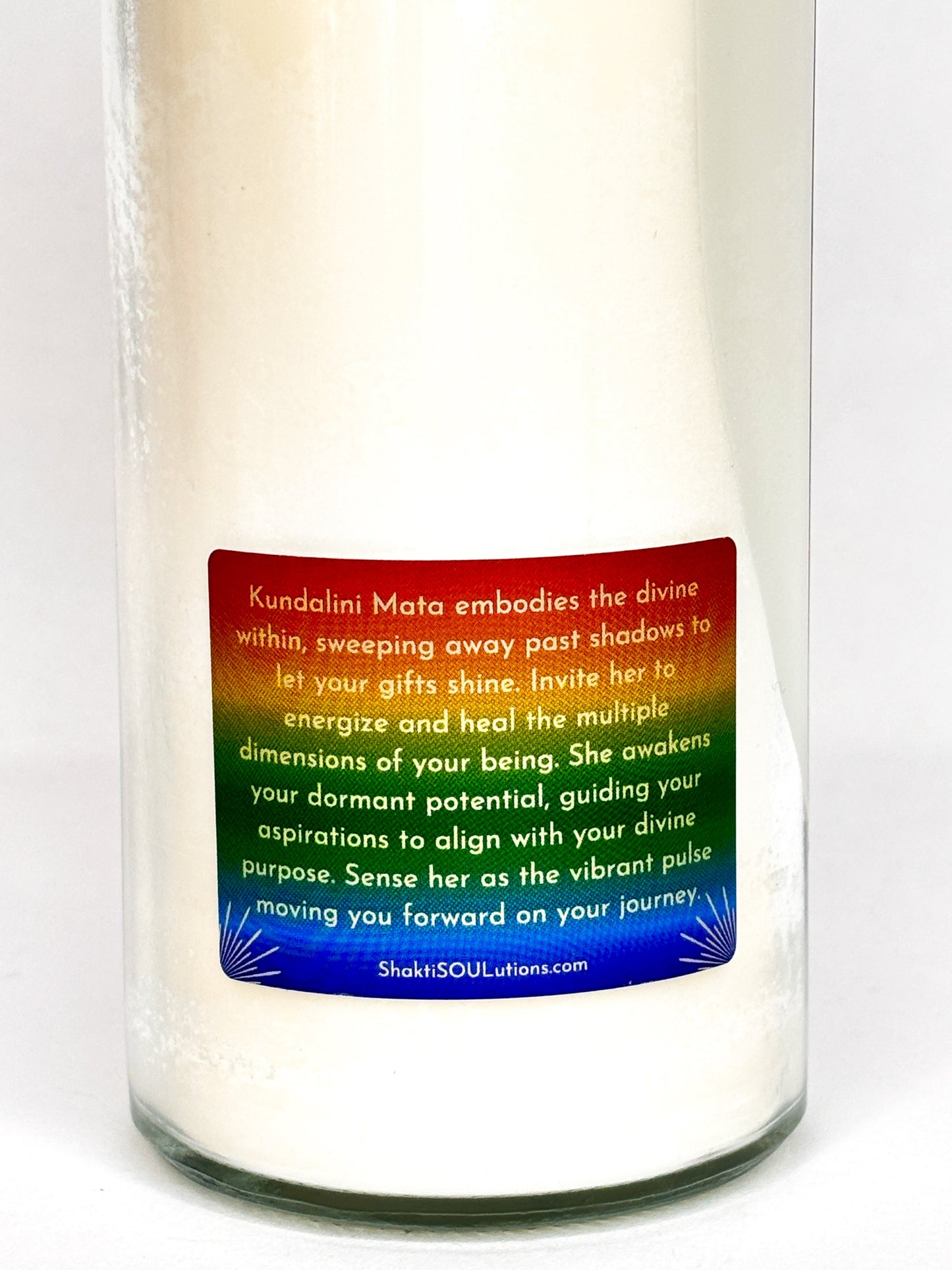 The Kundalini Shakti altar candle styled on a dark altar surface