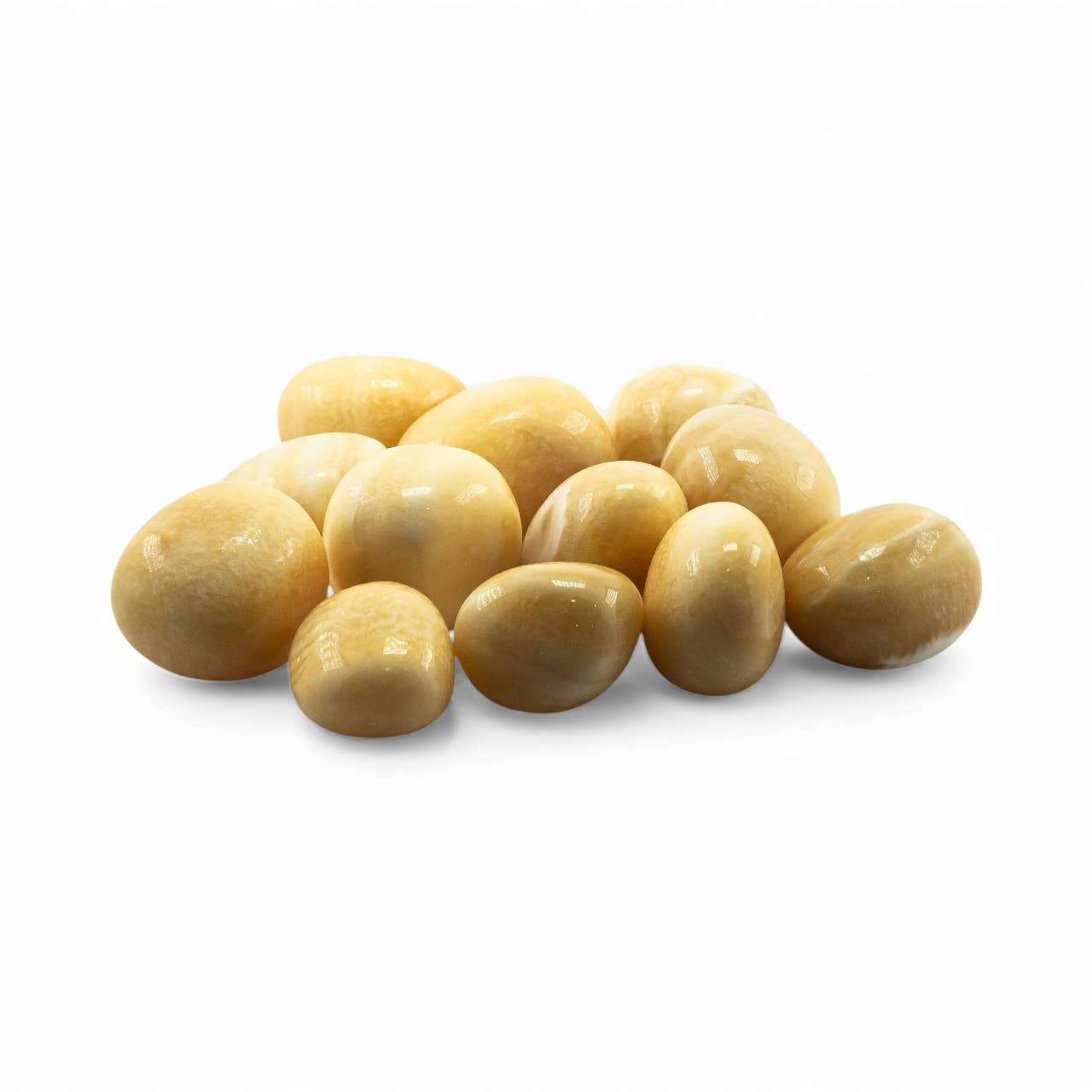 Close view of a warm yellow aragonite tumbled stone.