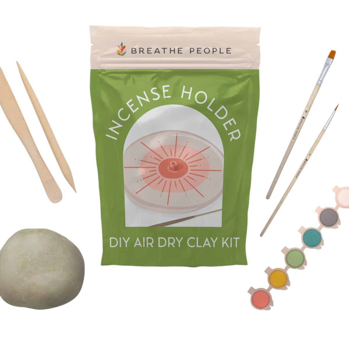 Air-dry clay kit pouch on white with modeling tools, brushes, paint pots and a ball of clay