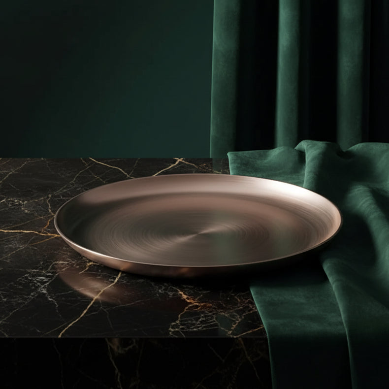 Hand-cast Kansa bronze platter on dark marble with green velvet