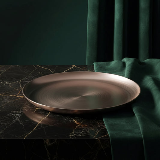 Hand-cast Kansa bronze platter on dark marble with green velvet