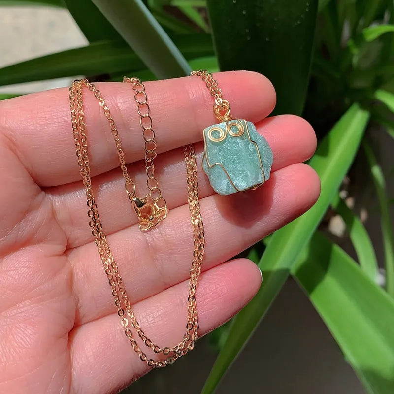 Raw wire-wrapped crystal pendant on a gold-plated stainless steel link chain — view 9 of 20