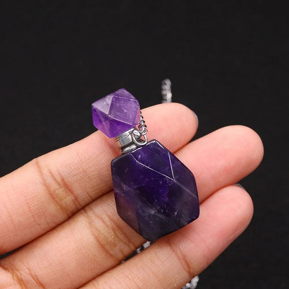 Small glass potion bottle pendant filled with crystals on a stainless steel chain — view 10 of 12