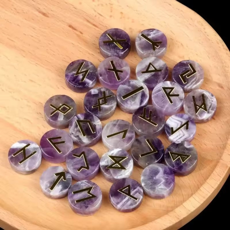 Set of round polished crystal runes engraved with runic symbols, scattered on a dark surface — view 2 of 12