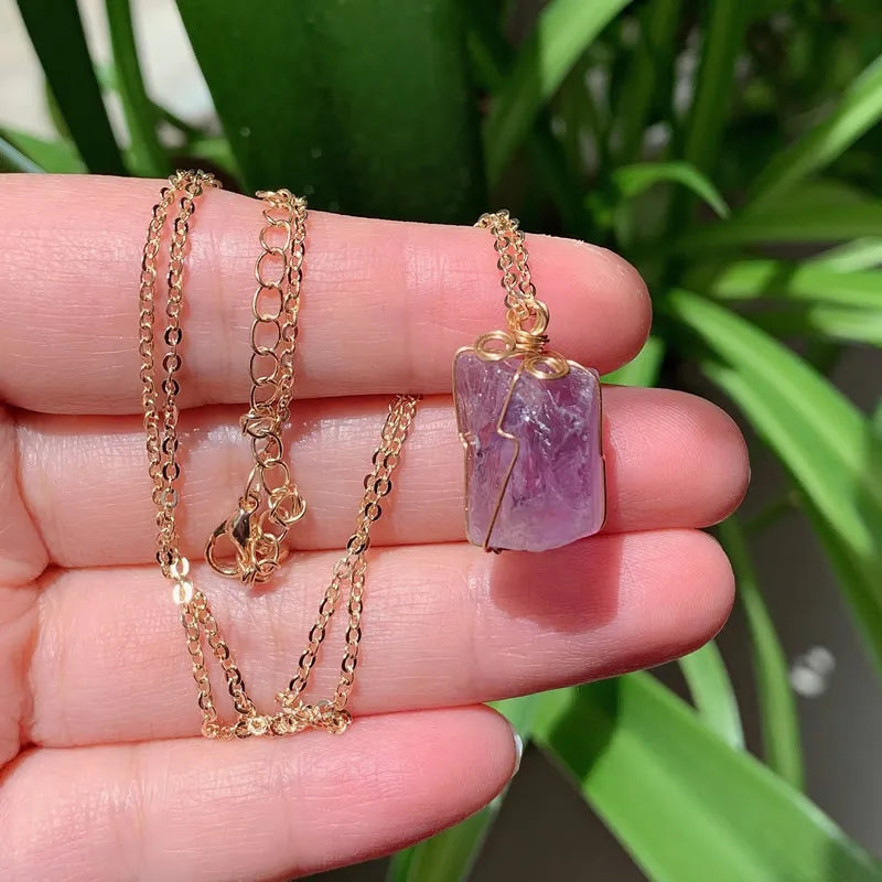Raw wire-wrapped crystal pendant on a gold-plated stainless steel link chain — view 11 of 20