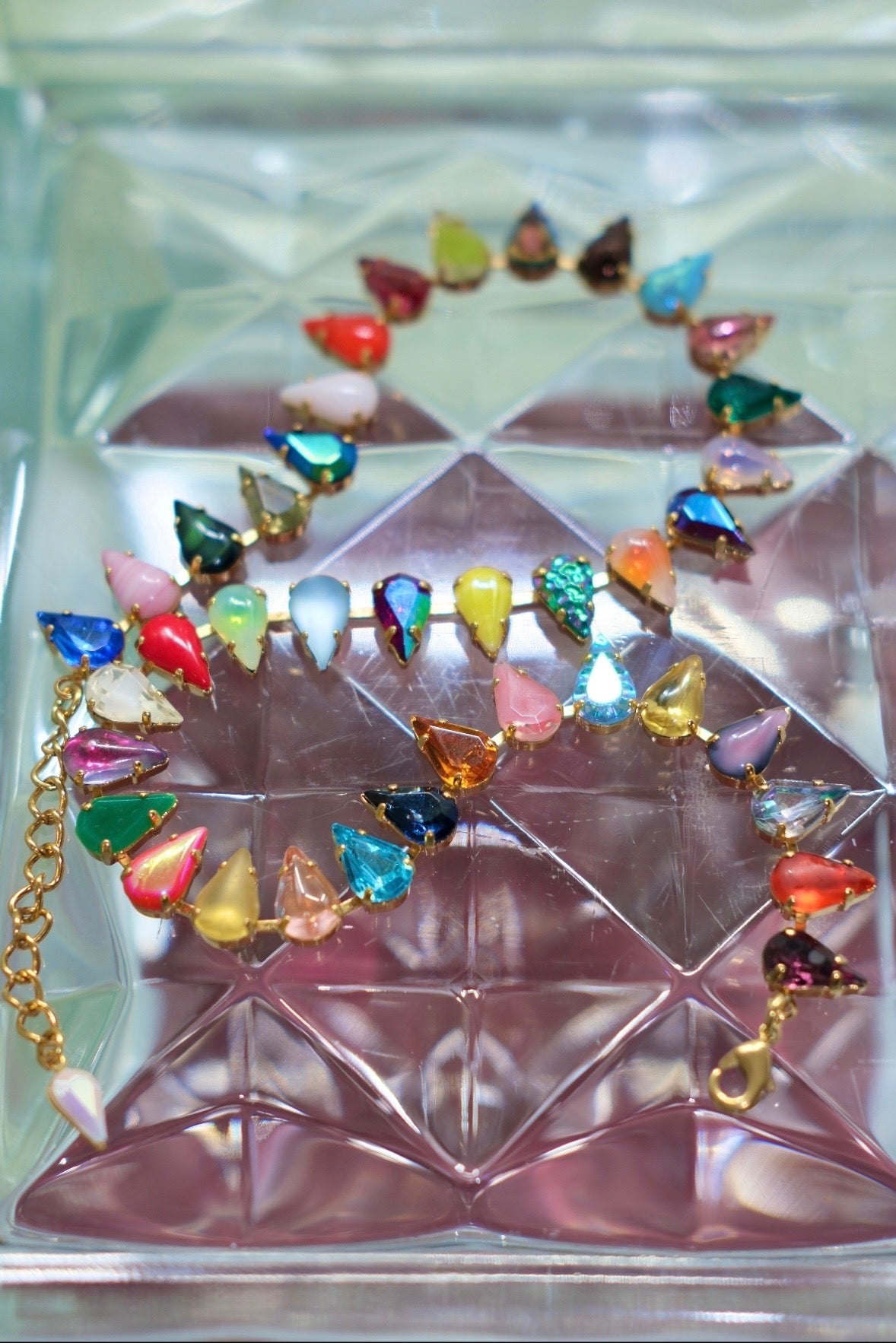 Detail of multicolor fang-shaped glass stones