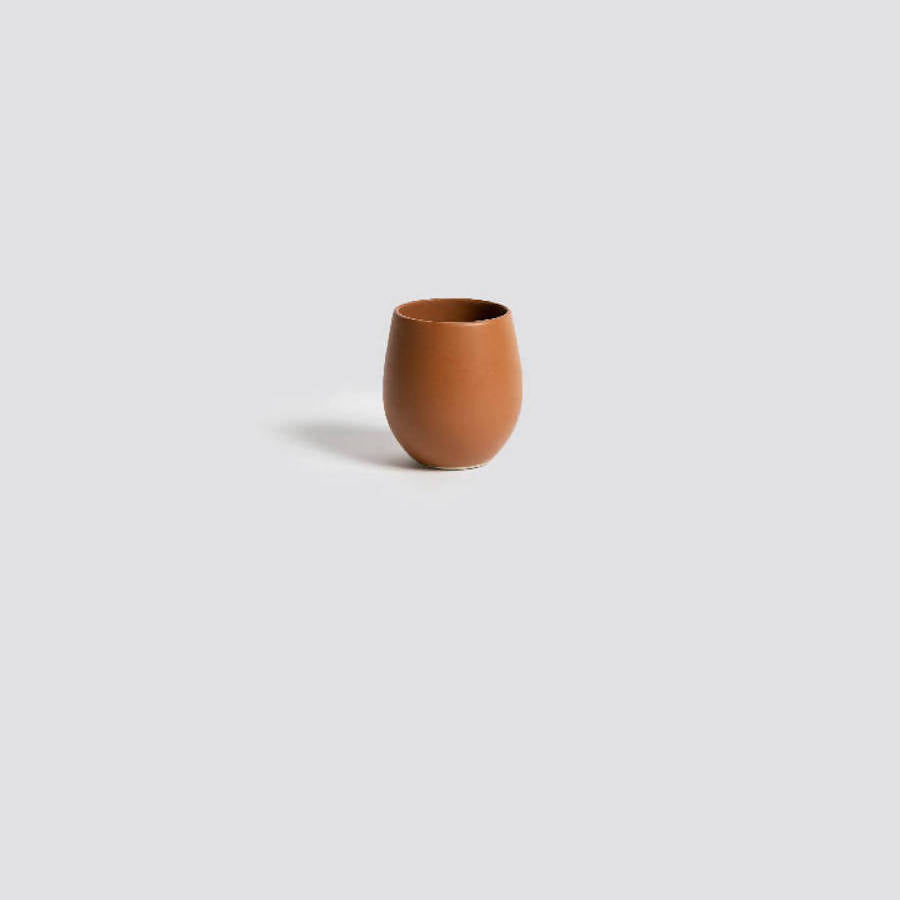 Epa stoneware cup on a gray background, showing the 10 oz size