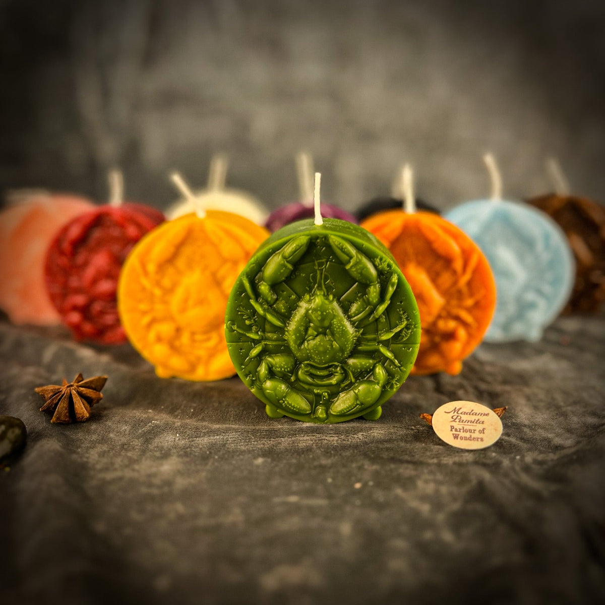 Cancer Crab zodiac spell candles grouped together in several colors