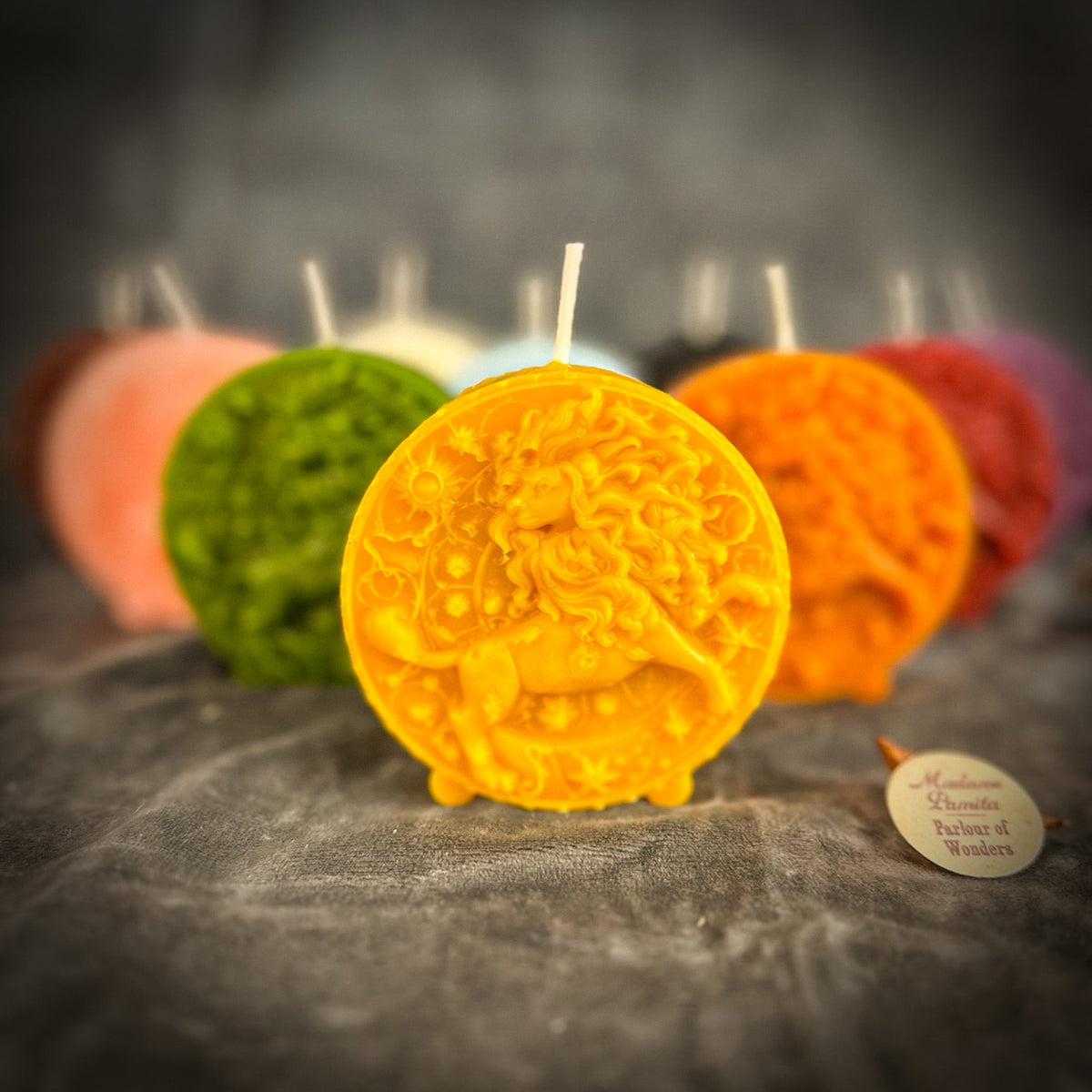 Leo Lion zodiac spell candles grouped together in several colors