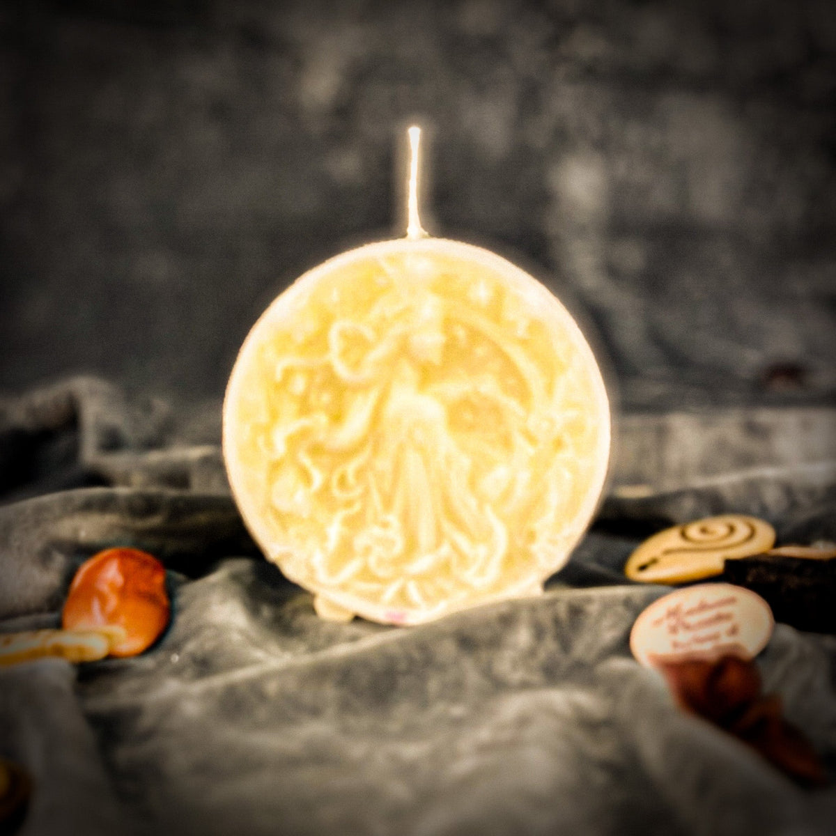 Libra Scales zodiac spell candle in white on draped gray fabric