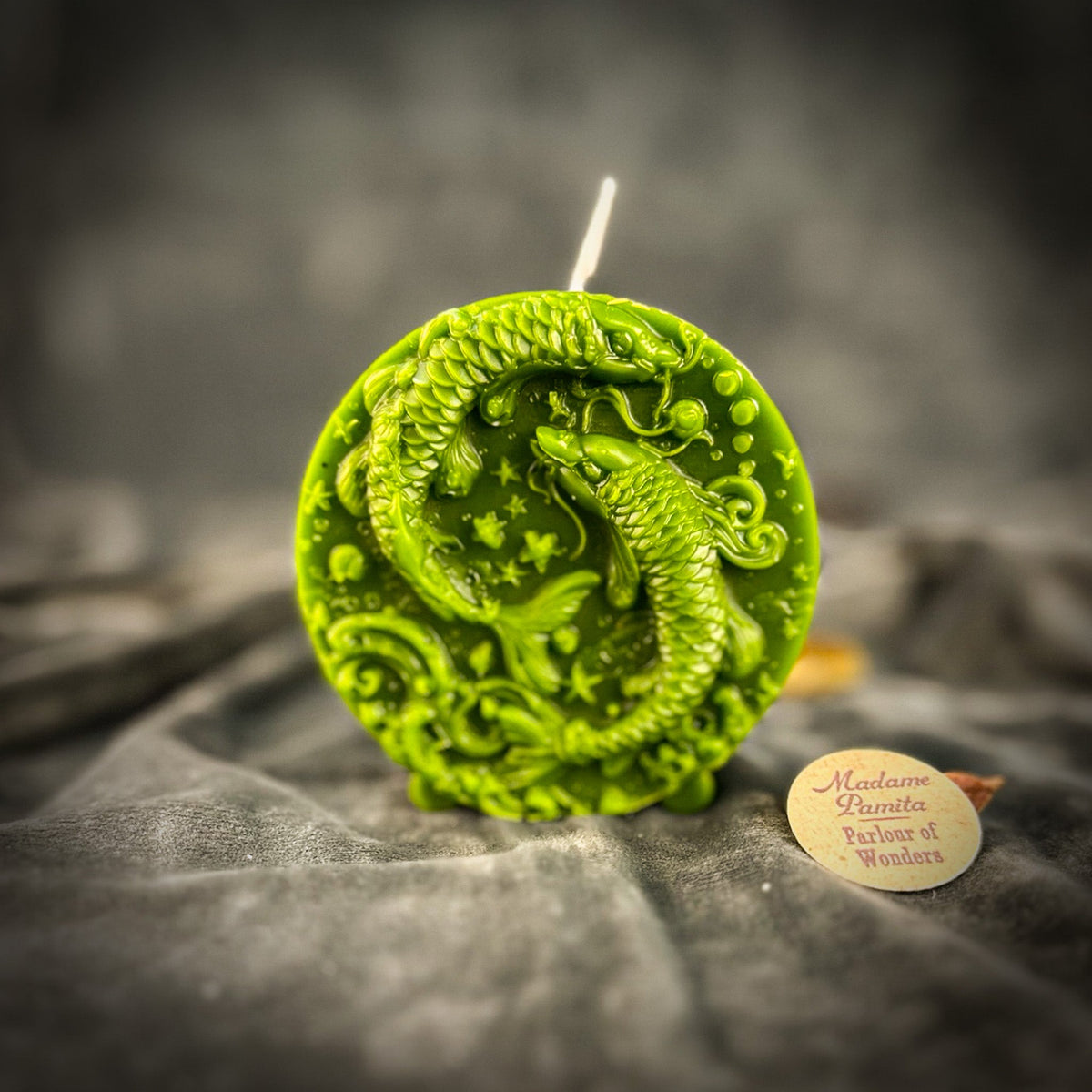 Bright green Pisces medallion candle, scales and fins crisply molded.