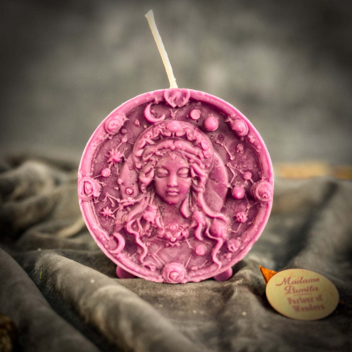 Mauve-pink Virgo medallion candle, the Maiden's hair and the surrounding star border sharply molded.
