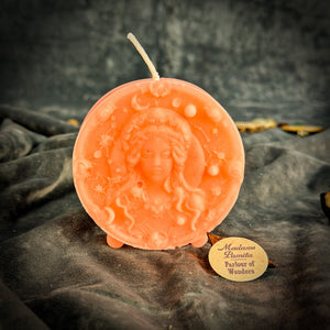 Peach Virgo medallion candle, softer relief where the wax cooled smooth.