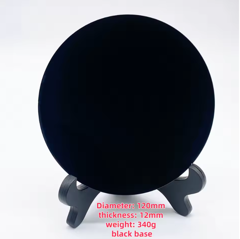 Round polished black obsidian scrying mirror resting on its base stand — view 11 of 11