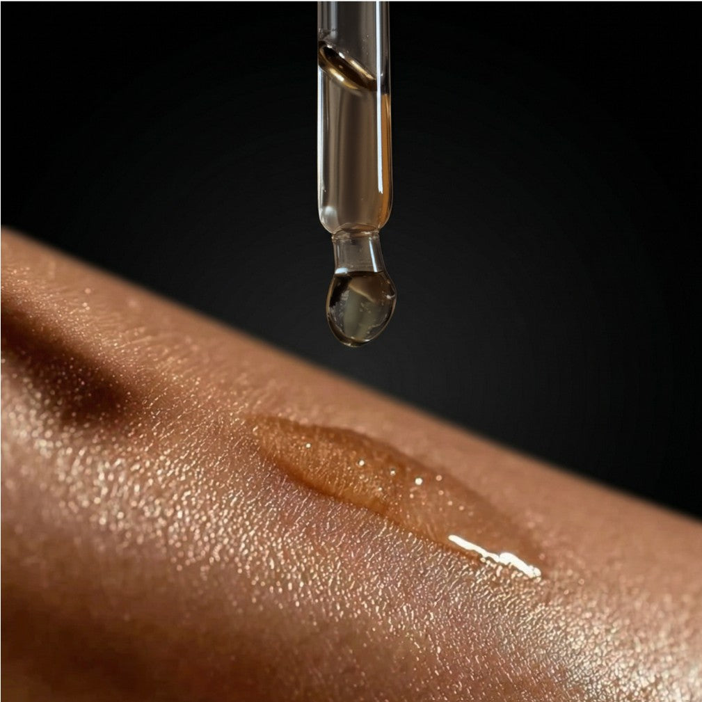 Citrine gemstone shimmer body oil in an apothecary glass bottle with citrine crystals (view 2)