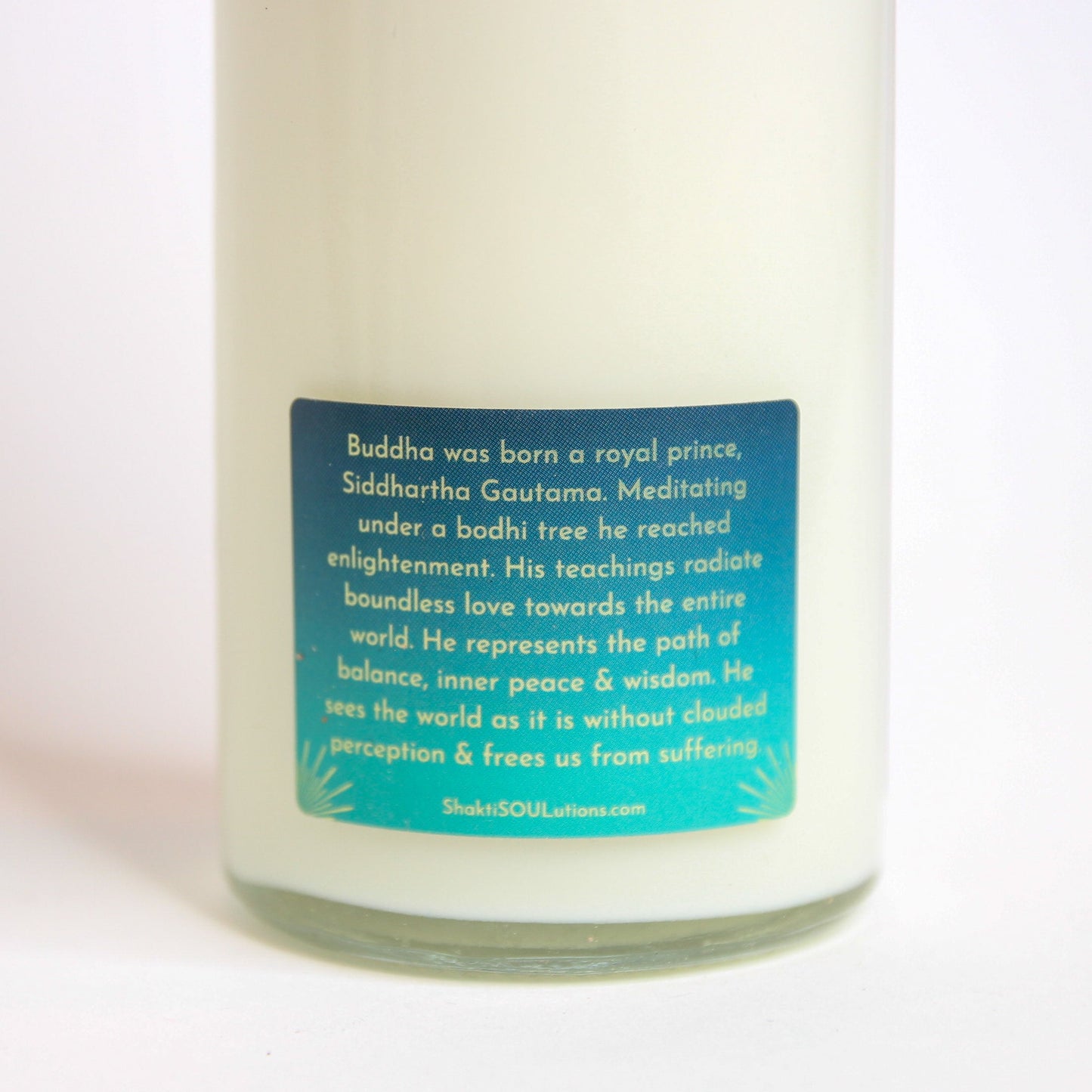 Buddha Crystal Altar Candle in a 16 oz glass tumbler with an image of the Buddha on the label and pale crystals set into the wax — product photo 4